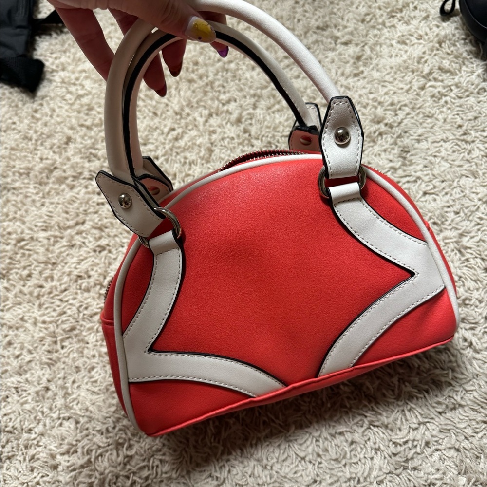 Small, reddish, handbag
